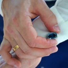 The groom straightens cufflinks on his shirt. Fees groom, Wedding and honeymoon in the tropics on the island of Sri Lanka